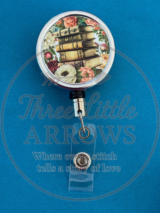 Floral Book Stack Badge Reel